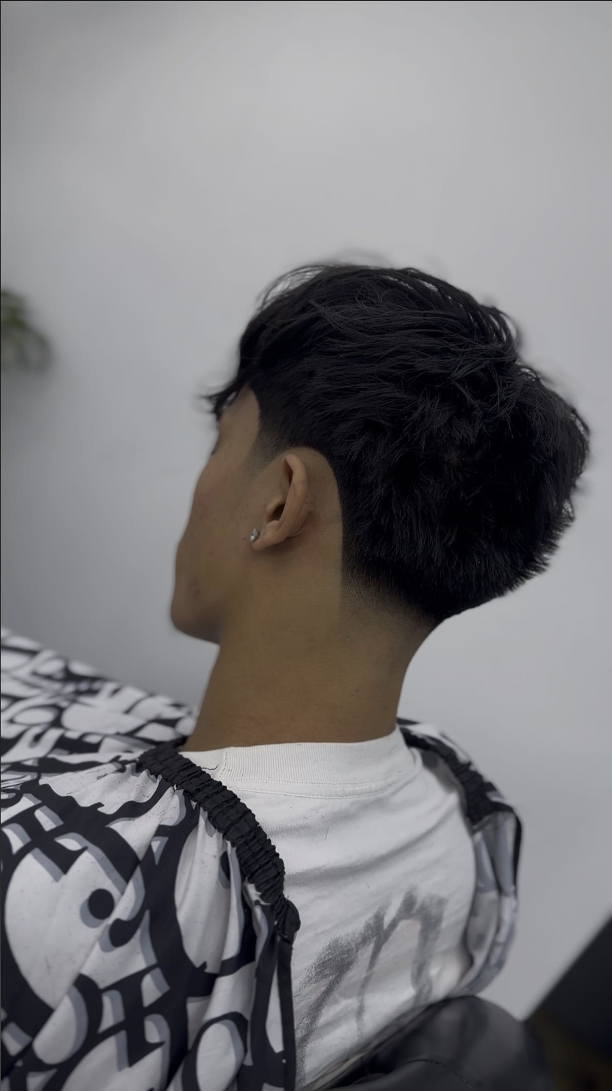Tapered crop haircut viewed from the back